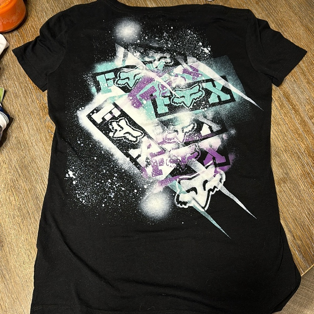 Never worn Women’s size small Fox racing V neck shirt